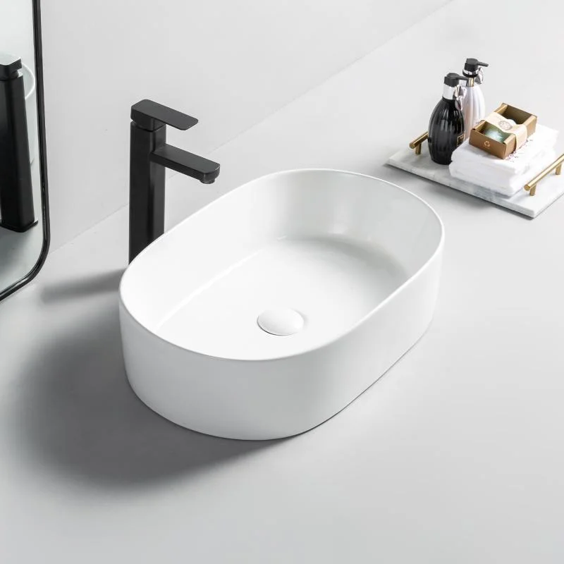 Lavoar oval Arezzo DAYTON, din porțelan, montaj pe blat, 56×36,5cm – alb